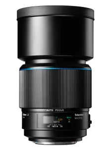 - Location de Studio équipé pour la Photo et la Vidéo Un objectif d'appareil photo noir en forme de cylindre large sur un fond blanc. Il possède des repères de mise au point et un interrupteur pour l'autofocus.
